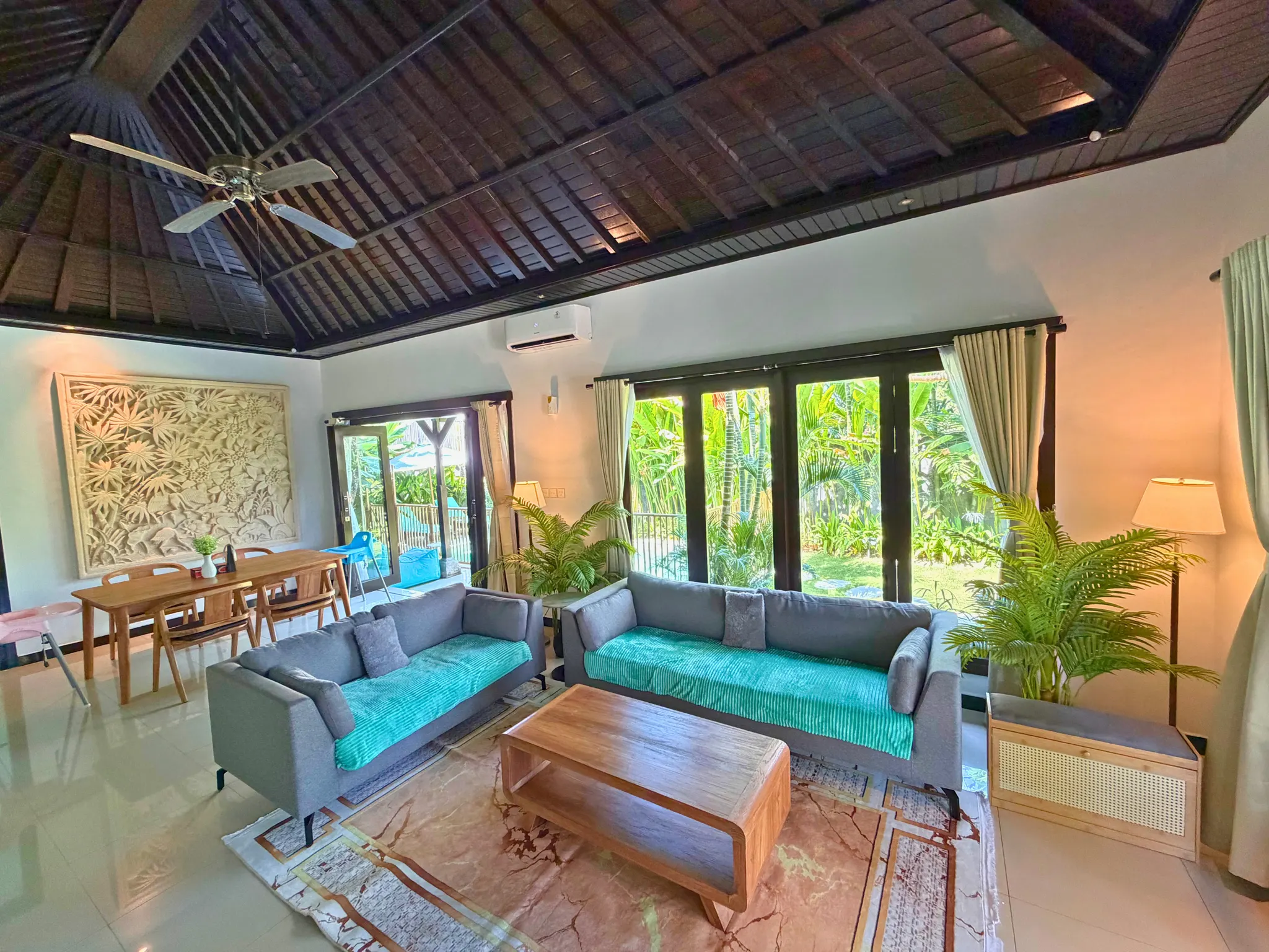 Enclosed living and dining area at The Santi Estate in Sanur
