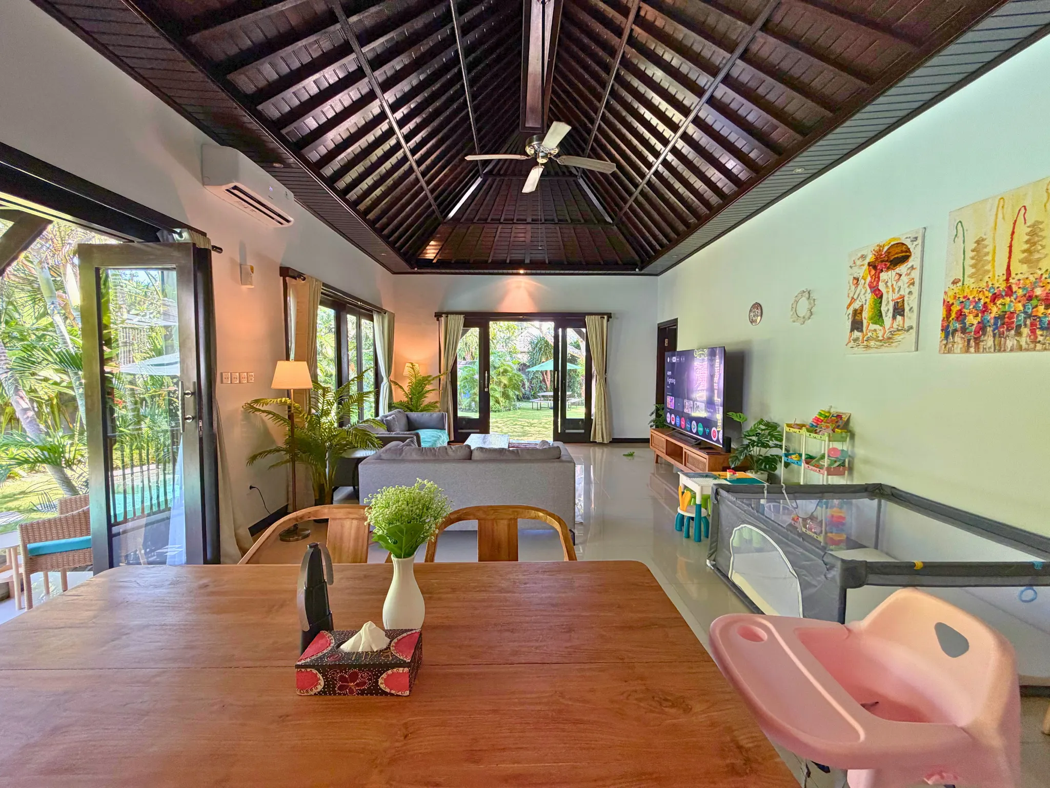 Dining area with view toward the children's play area at The Santi Estate